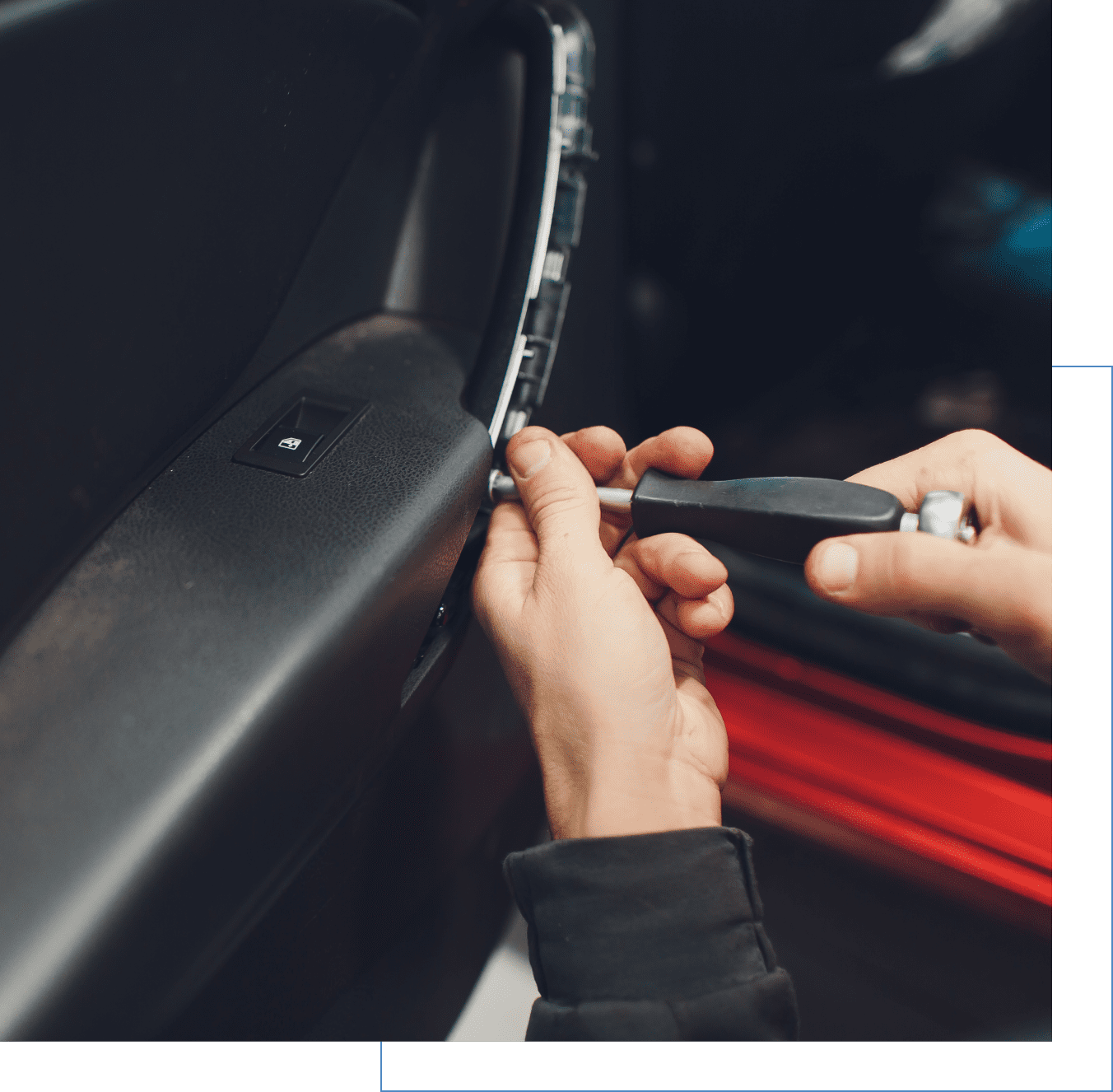 Person using a screwdriver to repair a car door panel, focusing on a hand holding the tool near the door's edge.