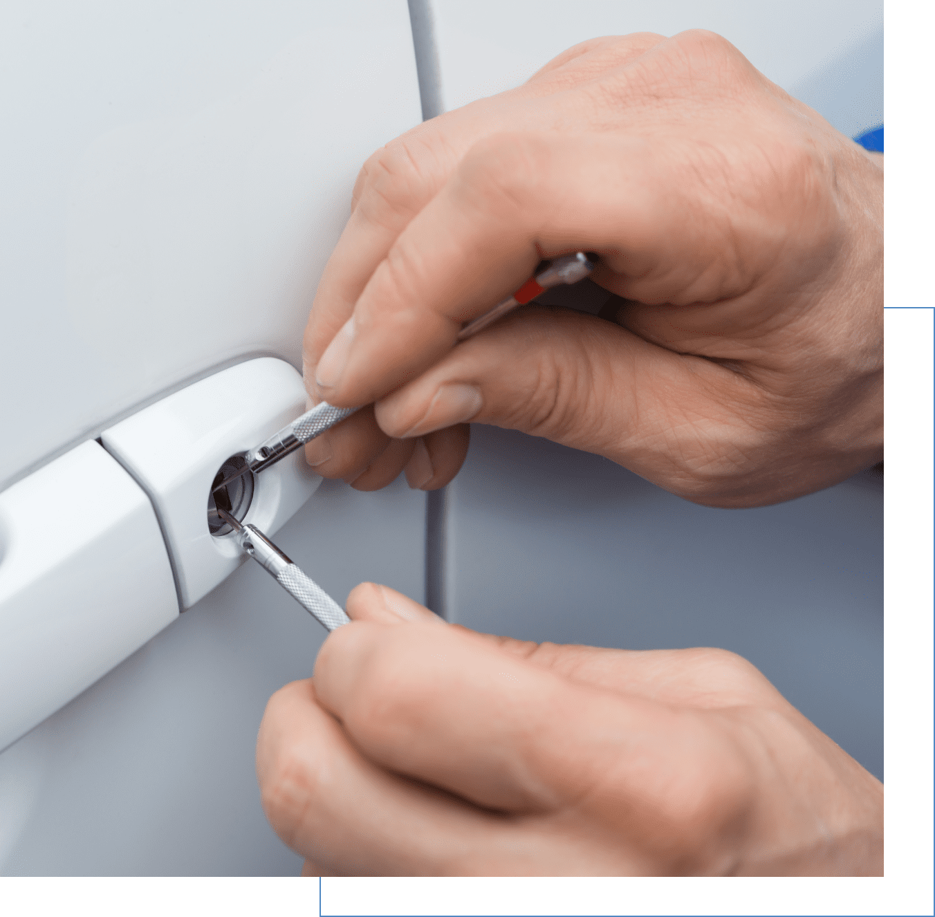 Hands using tools to pick a car door lock.